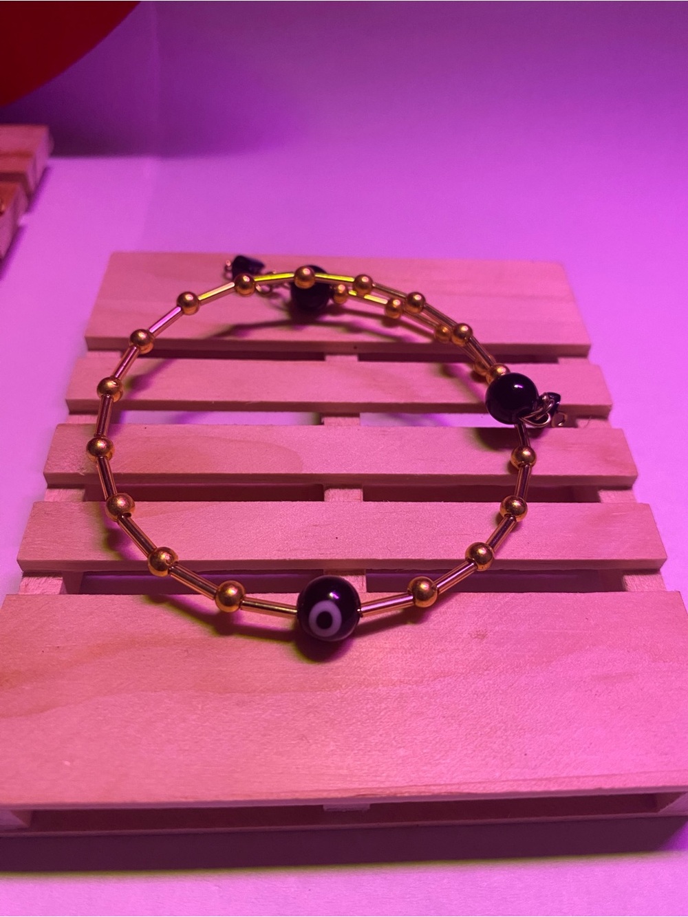 Gold-Tone Beaded Bracelet with Black Evil Eye Accent